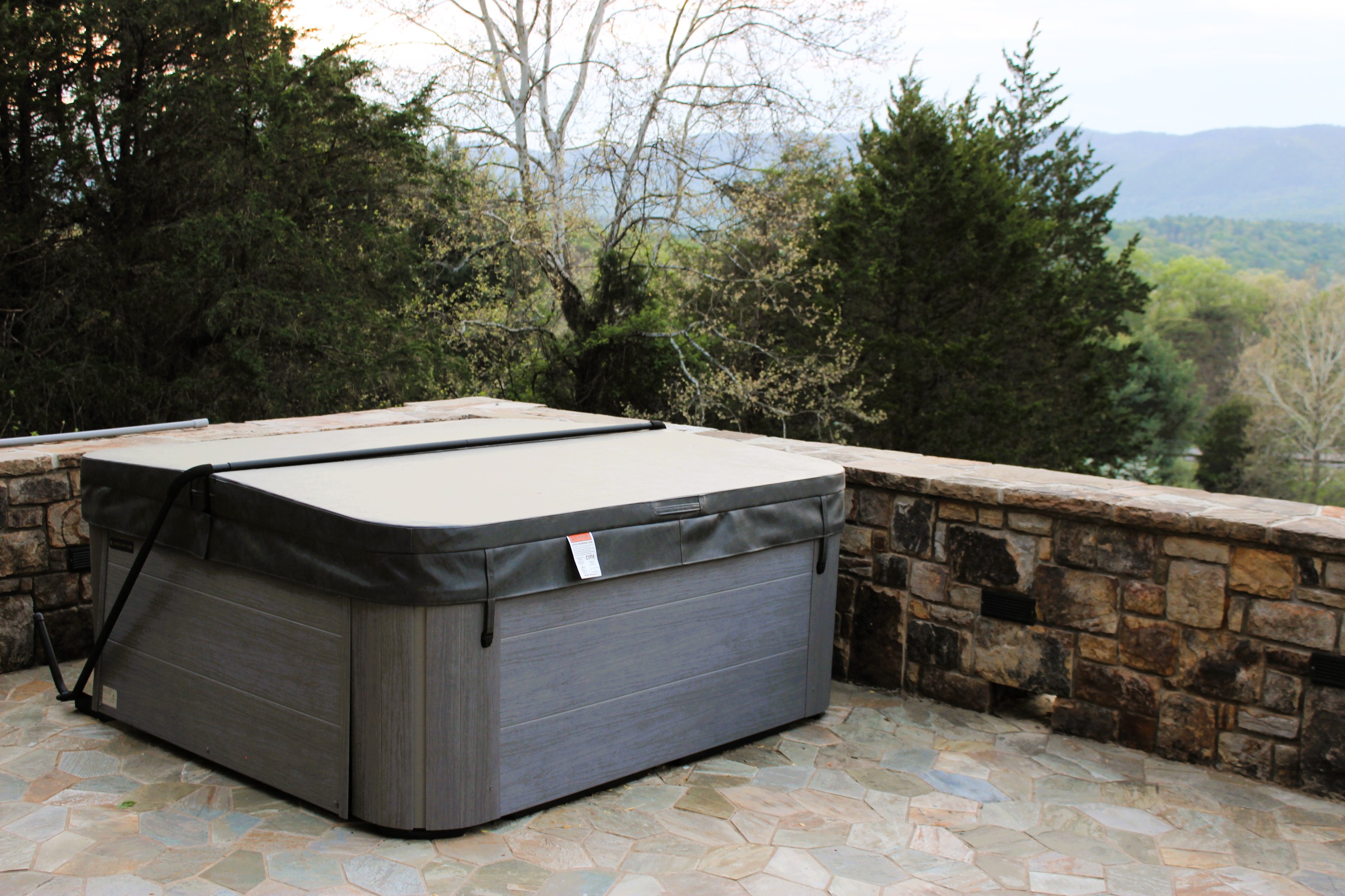 Soak in the hot tub while enjoying breathtaking views