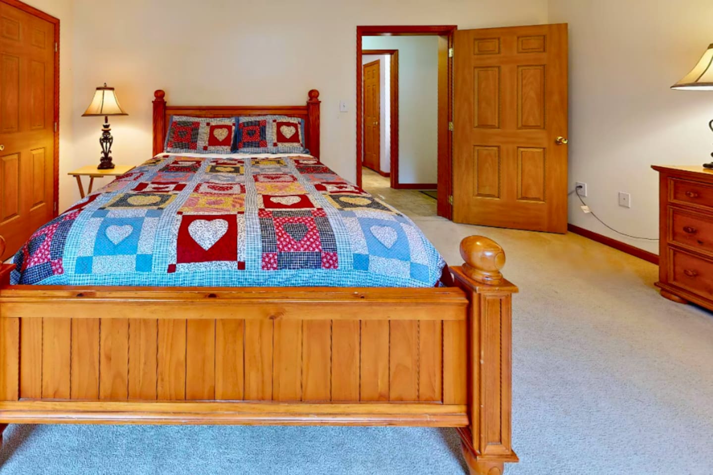 Second bedrooom on first floor with queen sized bed and full bathroom right across the hall!