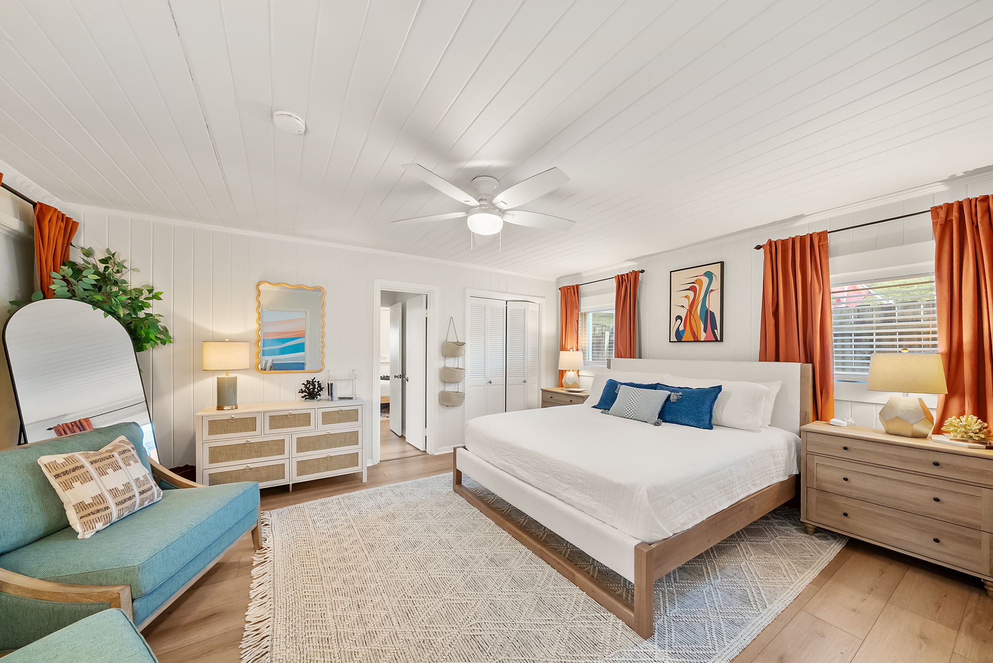 The primary bedroom gives the group leader their own retreat. A king bed, private dressers, armchairs, and arched mirror create a calm
space to come back to after the beach. Have a little one? The pack and plan and extra crib are in the closet!