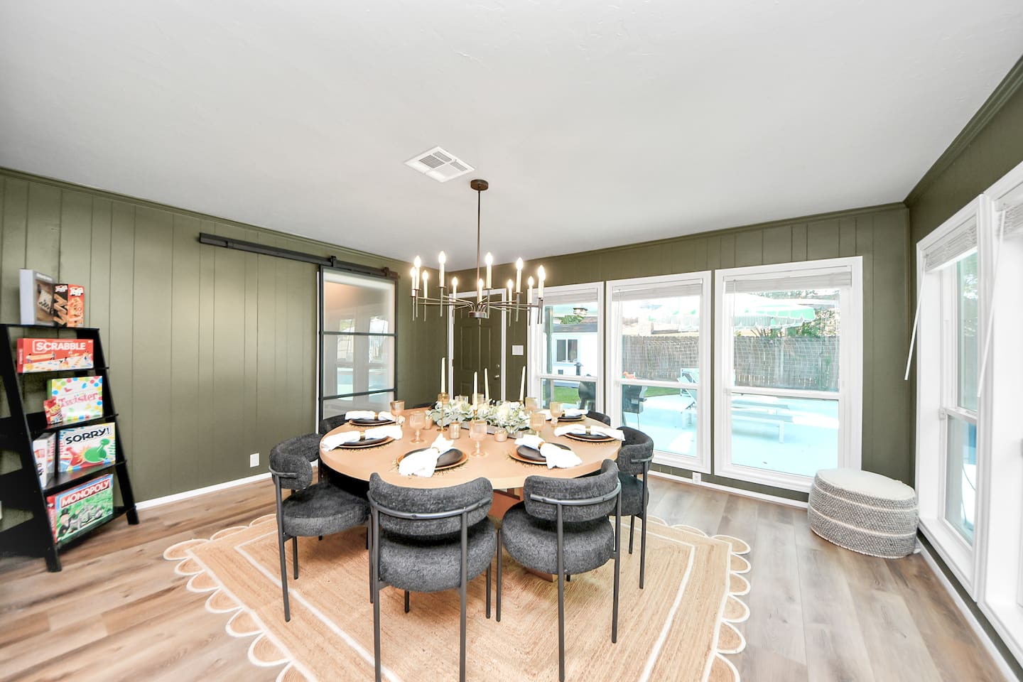 Large dining table that holds 8 and showcases amazing views of the backyard!