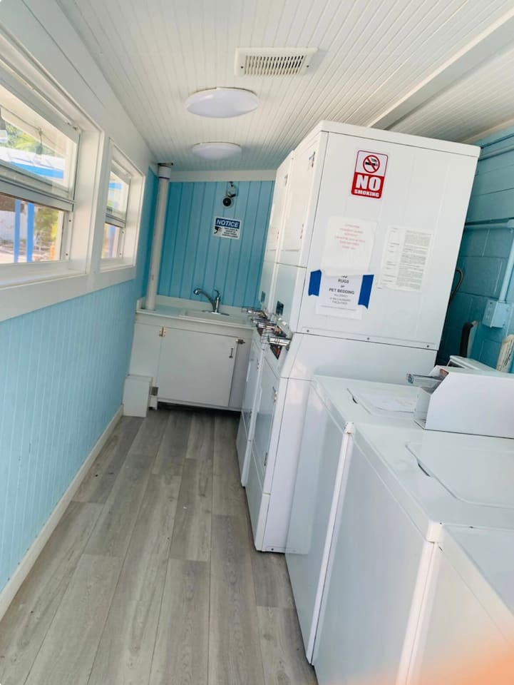 Coin operated laundry room. Open 24 hours. $2.00/wash & $2.00 to dry. 