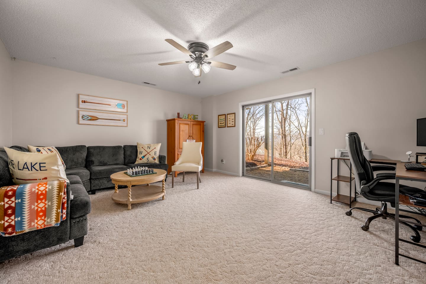 Second living room area: lower level of the home with office space and more