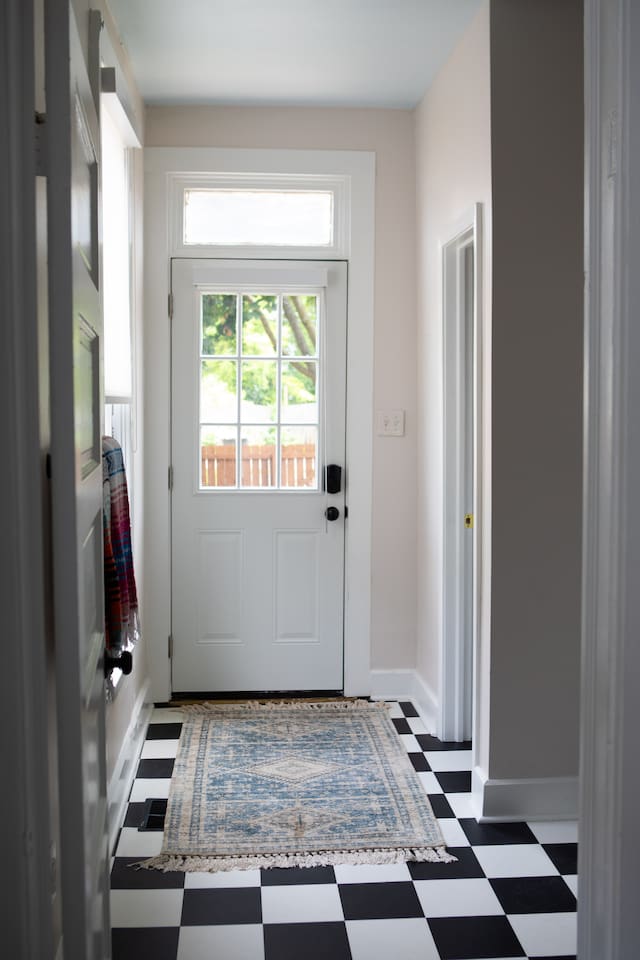 Rear entry just off laundry area, equipped with smart lock and access to backyard and private parking 