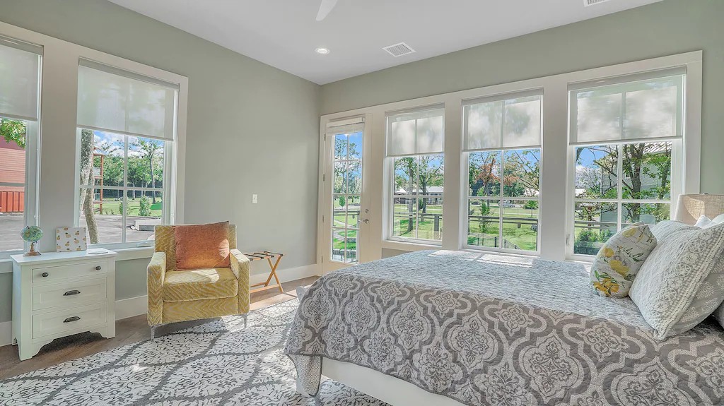 Sunny Windows off Main floor bedroom offer views of Waterfall. Balcony off this bedroom overlooking pond and waterfall.