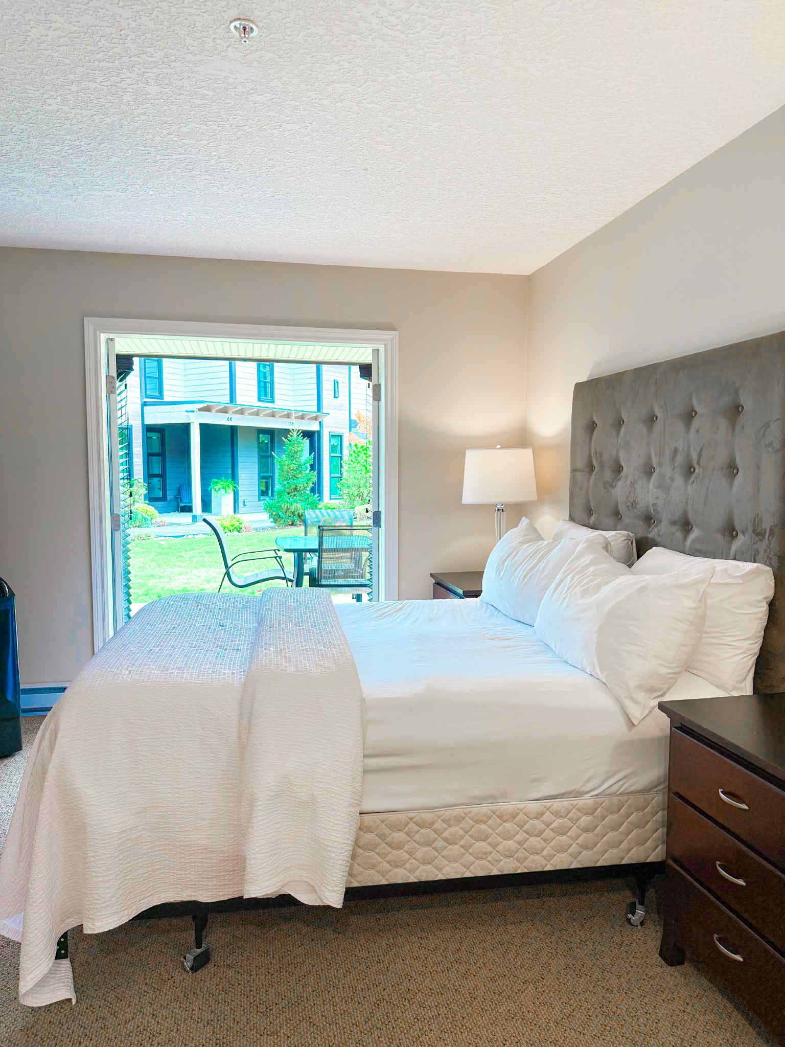 Unit A Primary Queen Bed - Double glass Patio doors.