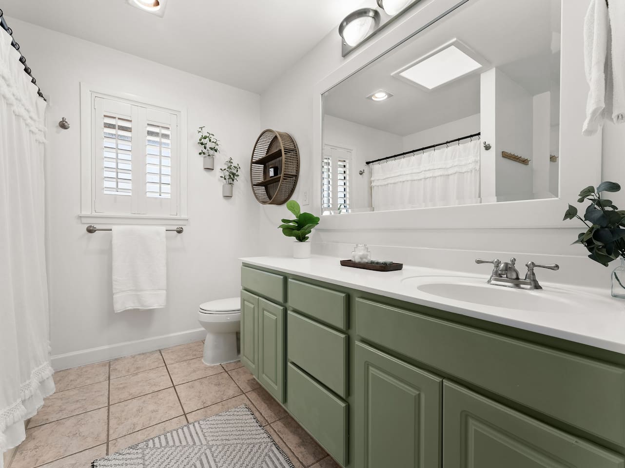 This 2nd floor bathroom offers attached access to "bedroom 2" and has another door at the hallway for shared access.