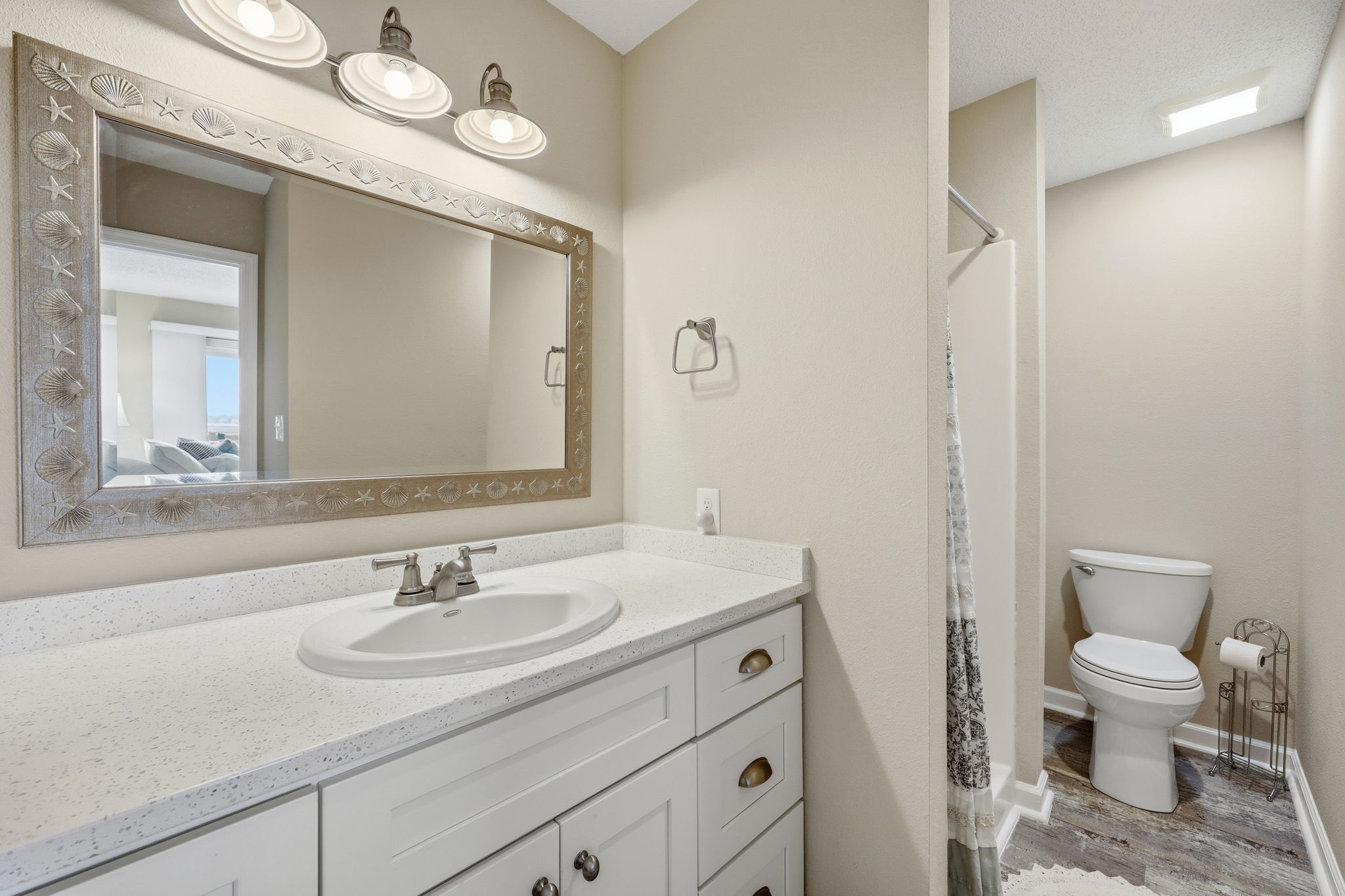 This spacious ensuite bathroom offers plenty of storage and a walk-in shower