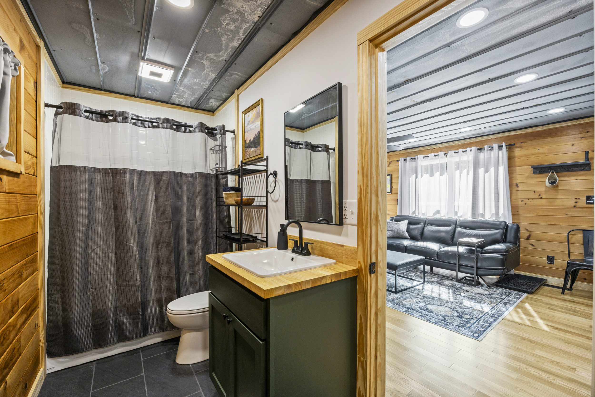 First bathroom with modern fixtures and a tub/shower combo.