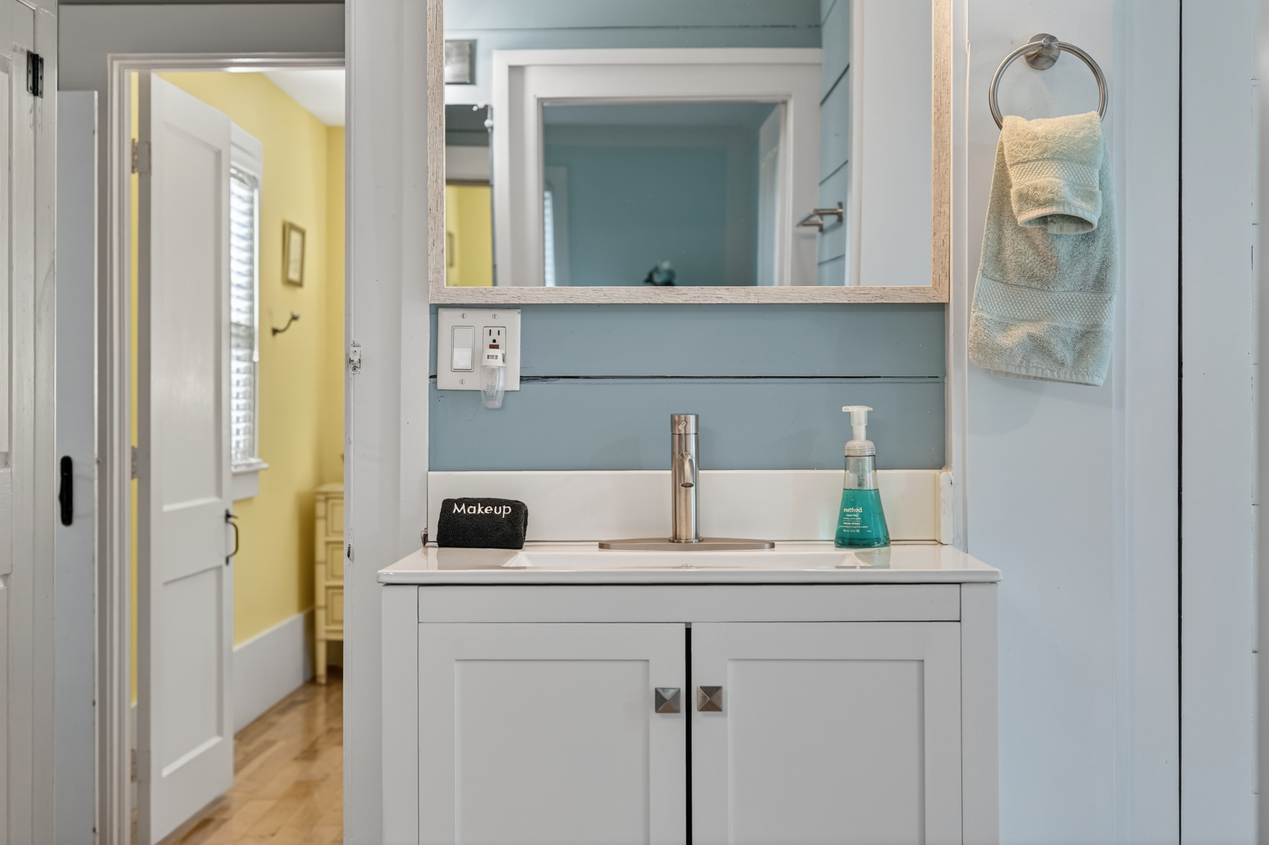 Clean and modern bathroom vanity with ample counter space and storage for your essentials.