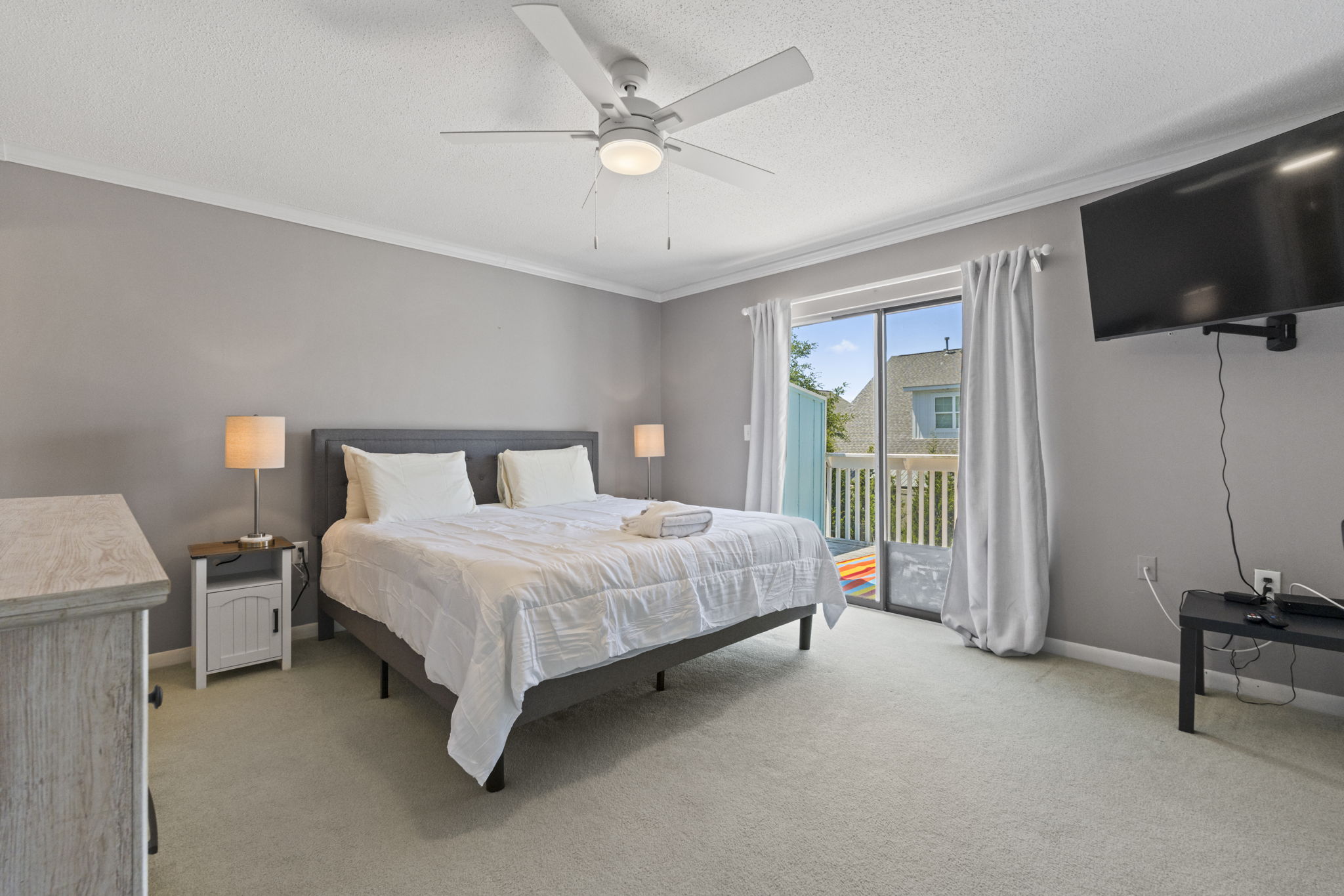 Primary Bedroom with King Bed, Smart TV & Ensuite Bathroom and Balcony