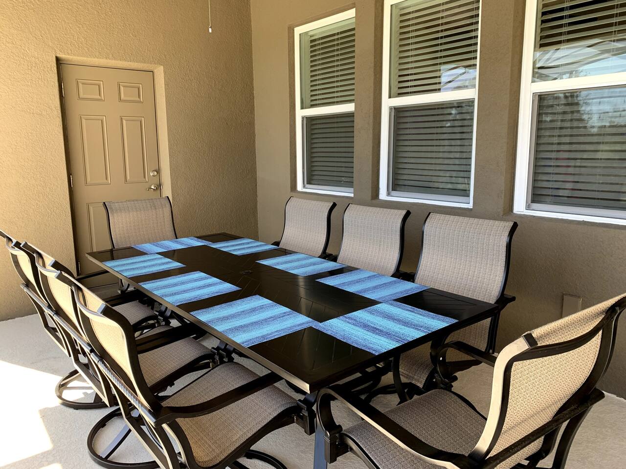 Outdoor seating area with 8 rocking swivel chairs. 