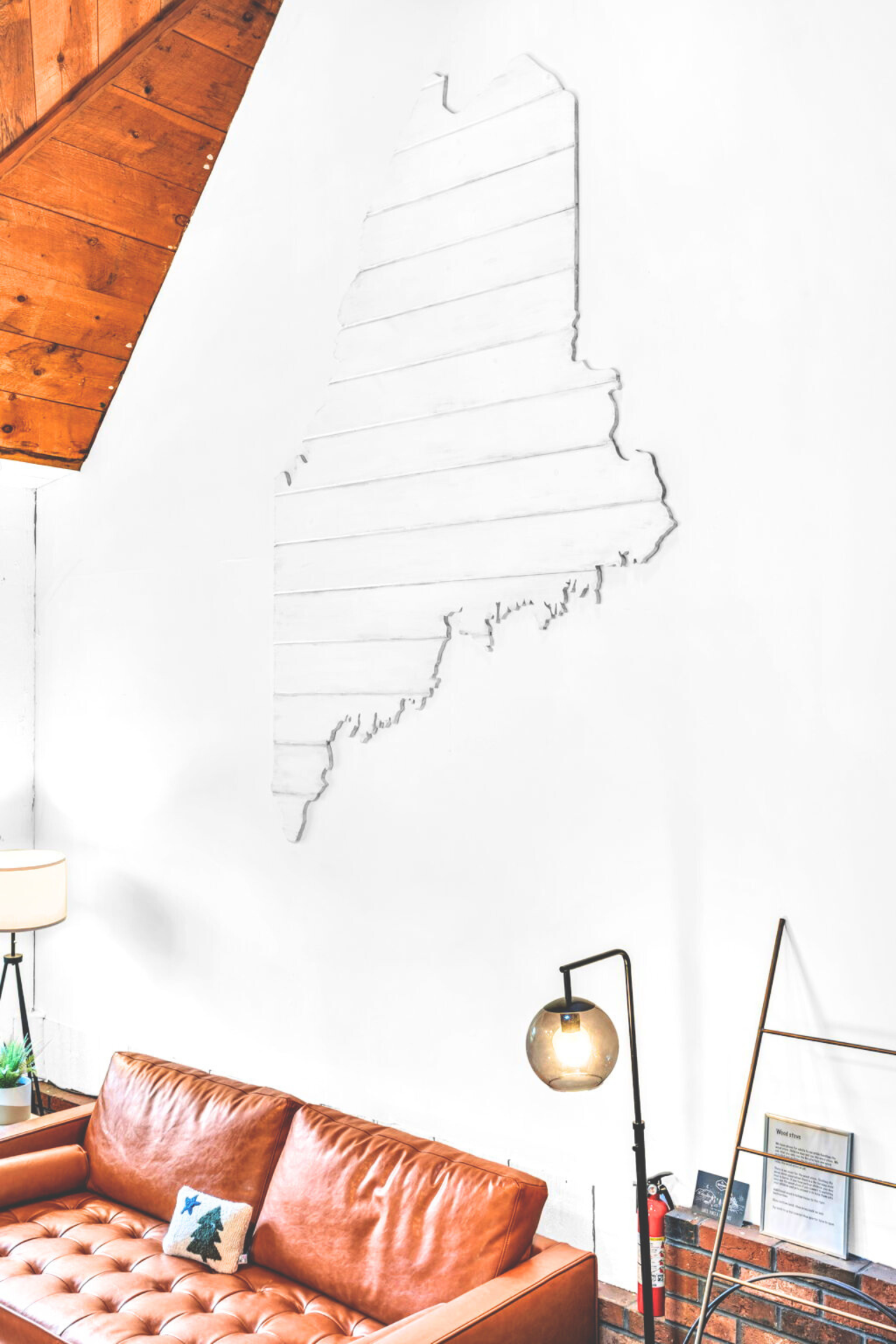 Showing our artistic side on the wall with the outline of Maine