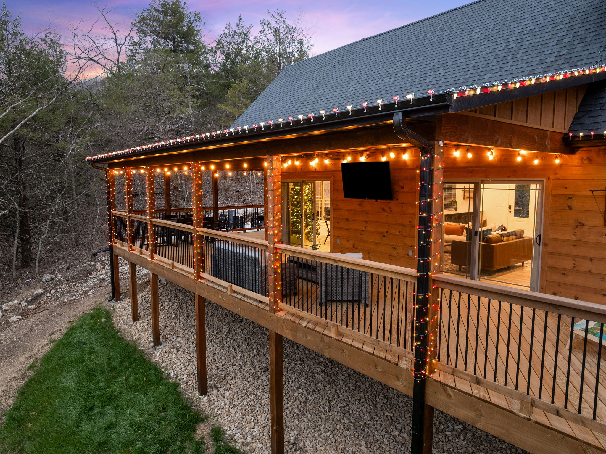 Covered deck with string lights for cozy nights outside.
