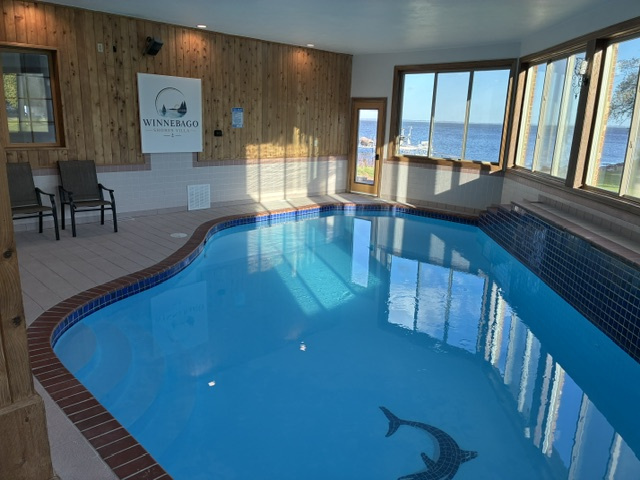 Pool photo with lakeview and Winnebago Shores Villa sign