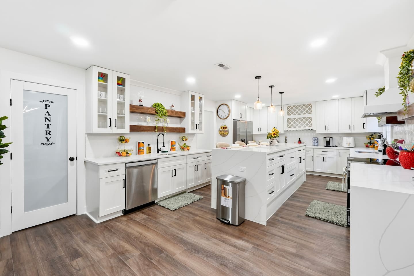Beautiful white kitchen fully equipped with all the appliances and essentials of a home away from home.