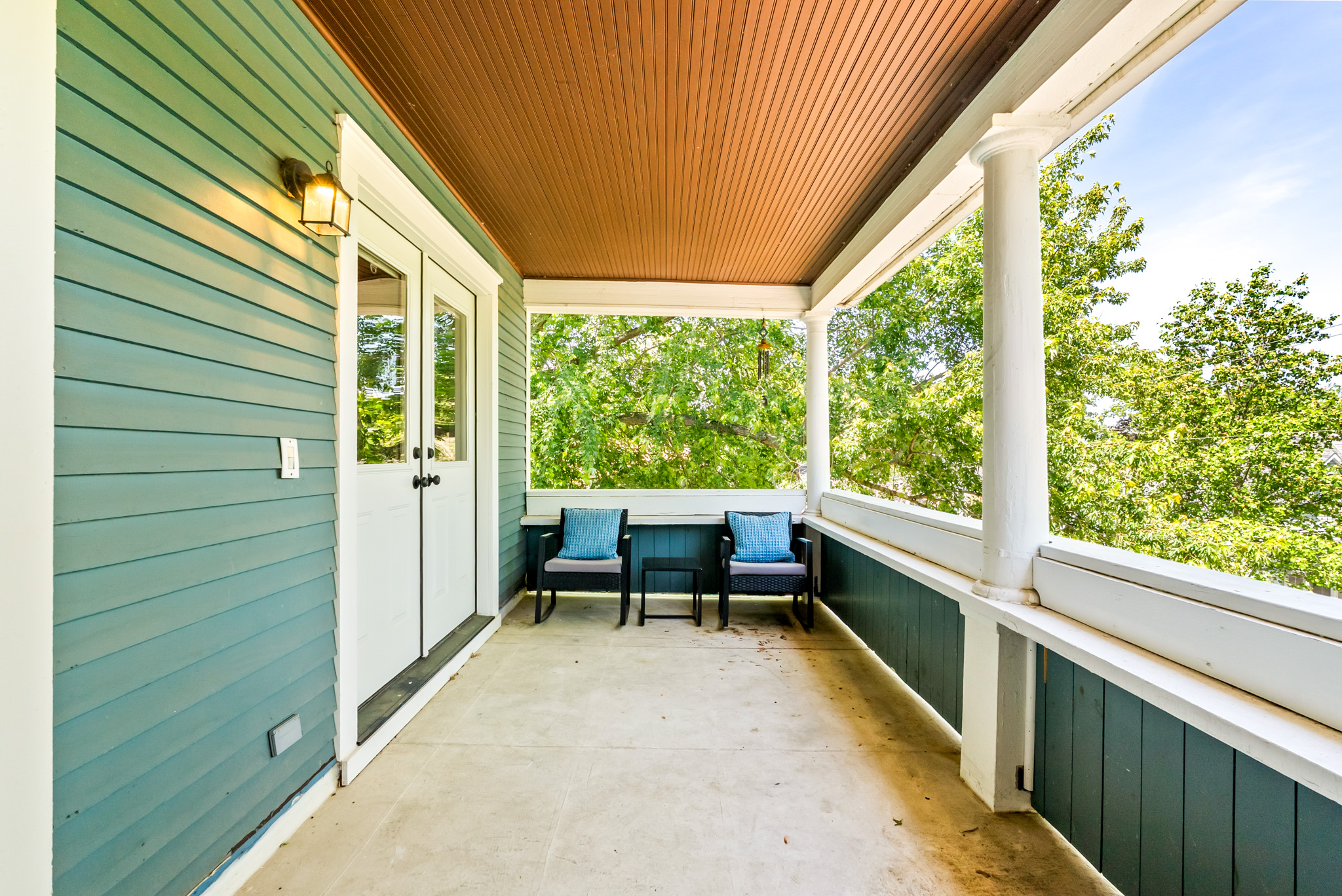 Bright and airy upstairs access. The historic French doors open wide to give guests a beautiful view and a private transition from the upper-level bedrooms straight out into the morning air.