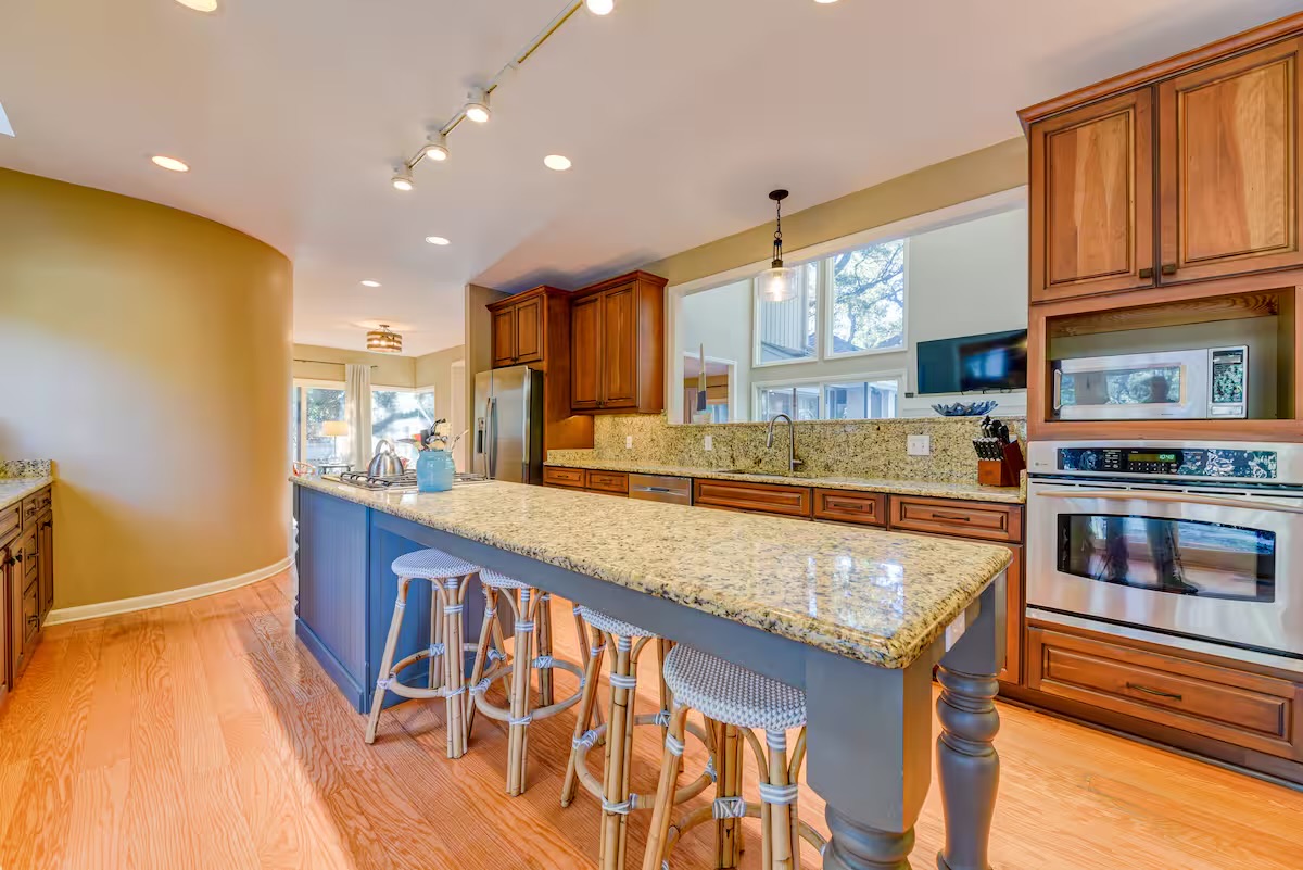 Plenty of meal prep and seating on this huge island