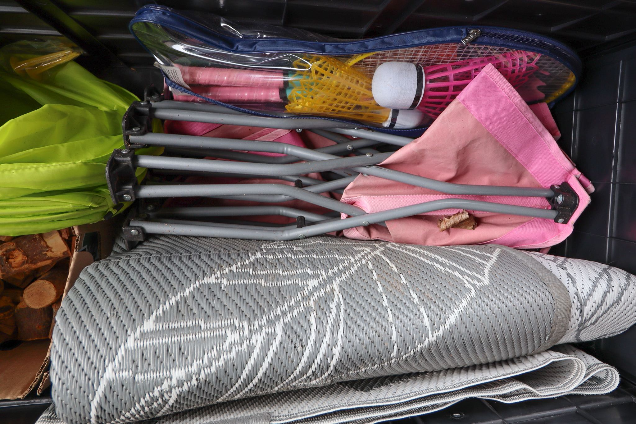 Tote on Shed porch with extra outdoor items and games