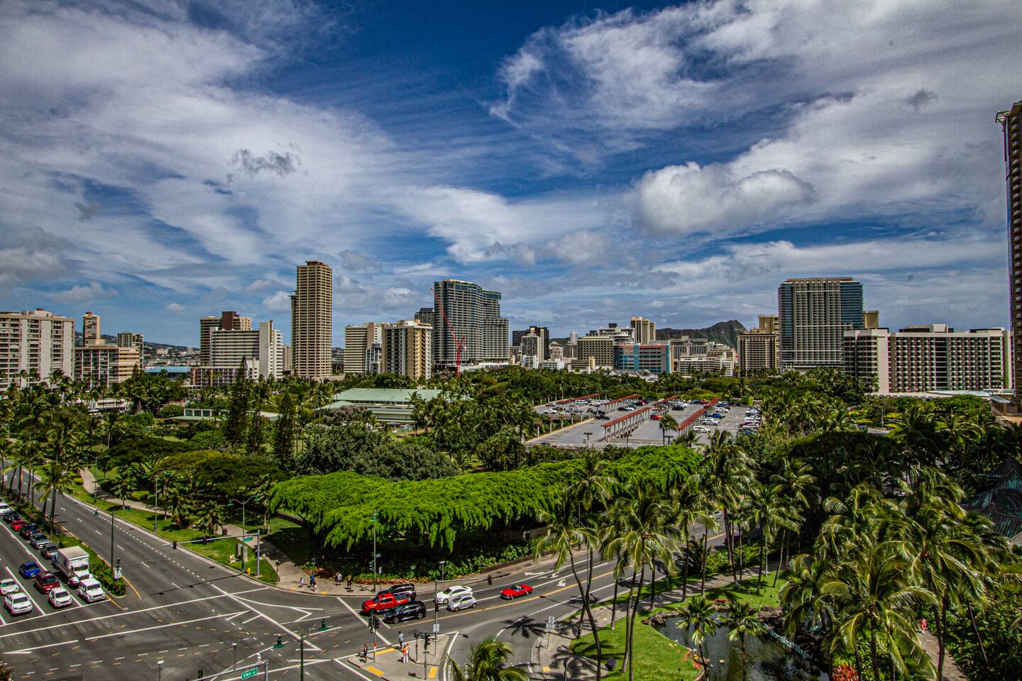 City/street views from balcony.  Hilton Hawaiian Village located across the street.  Fort DeRussey Park across the street