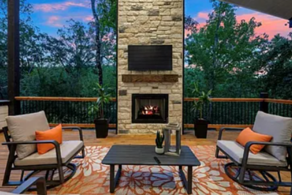 Stylish patio seating area centered around a fireplace