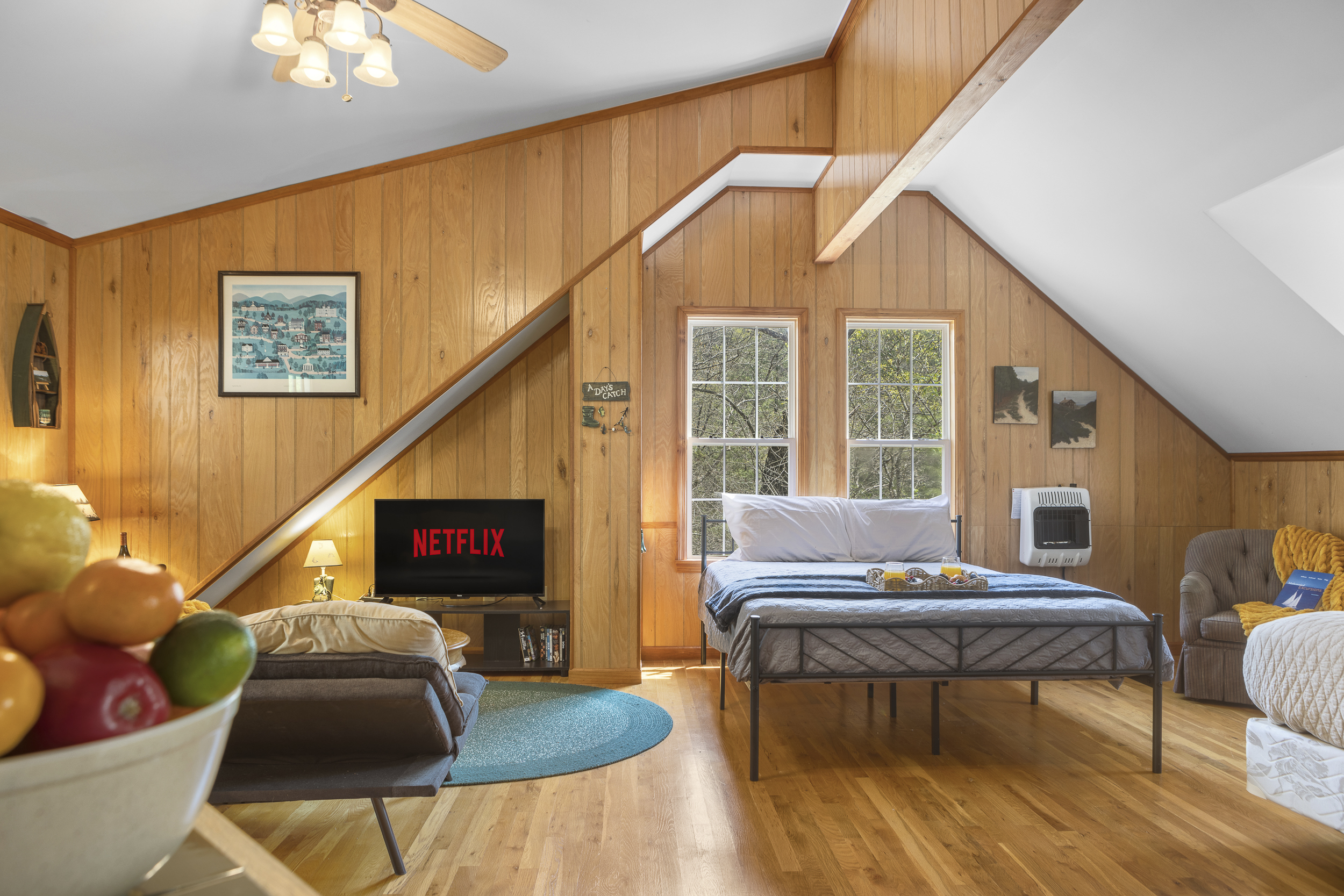 Queen Bedroom 3: Enjoy stunning woods views from this inviting room with Netflix access!
