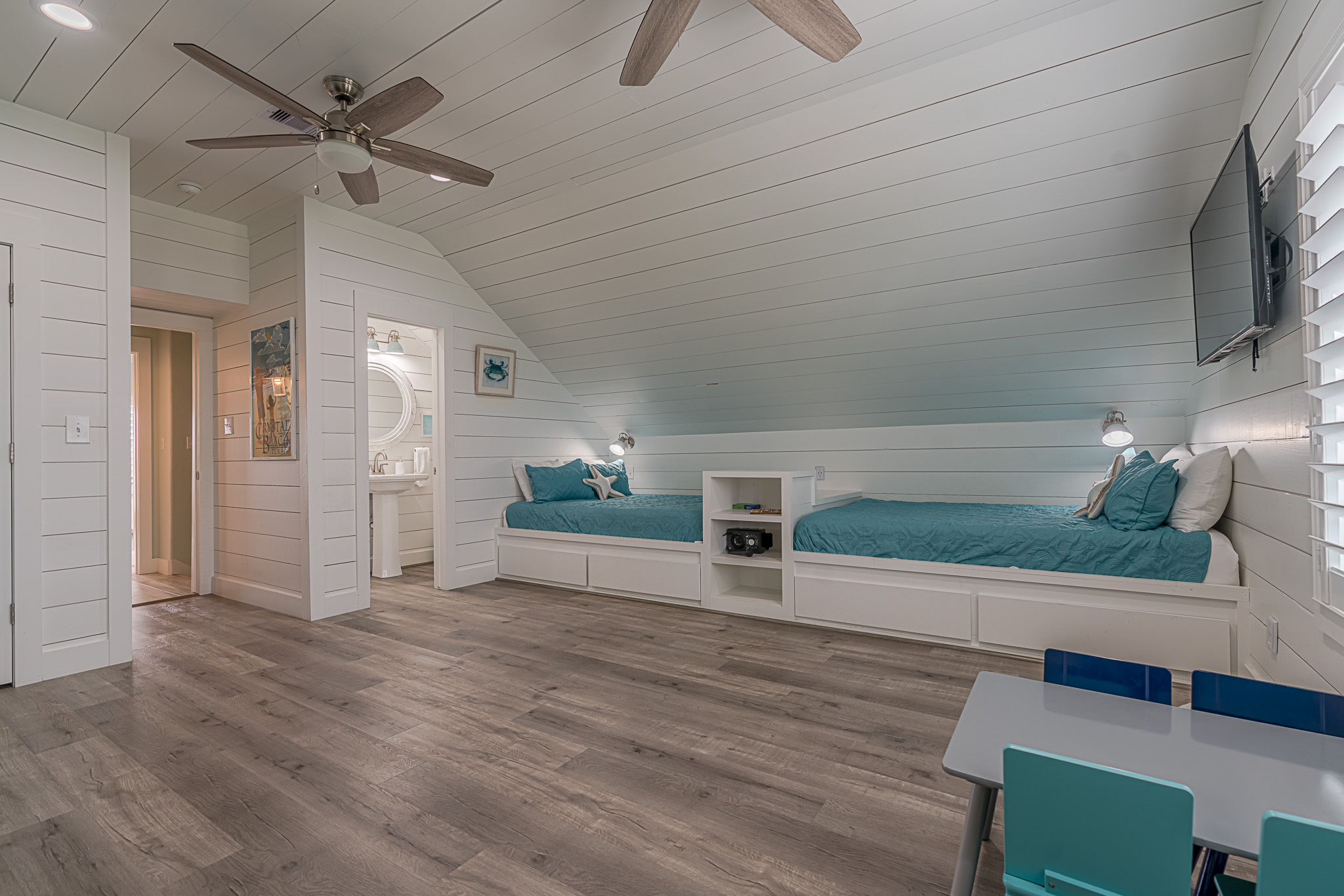 Built in queen beds on both sides of the room with games and a karaoke machine