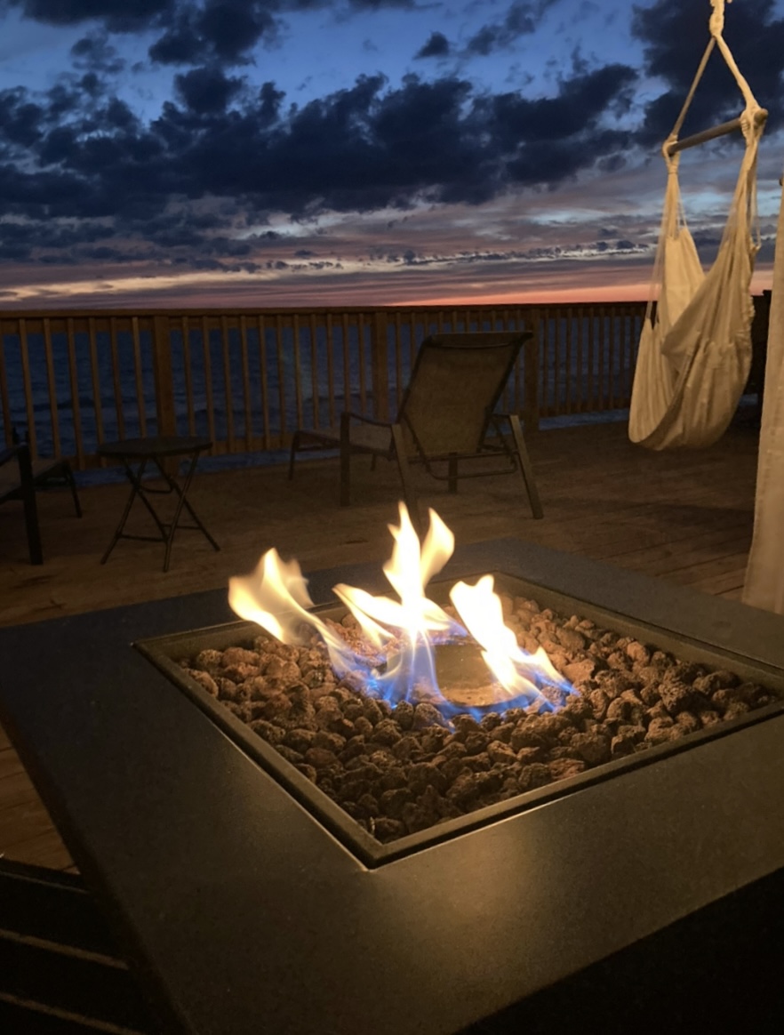 Enjoy relaxing on the deck by the firepit