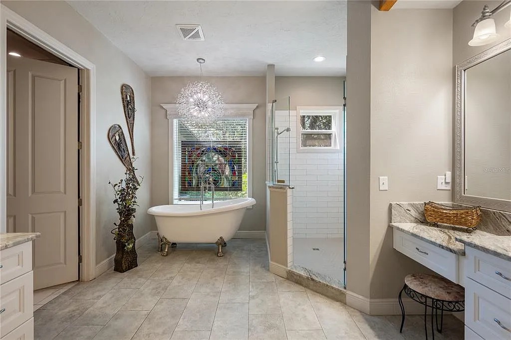 One of our elegant bathroom with a classic soaking tub.