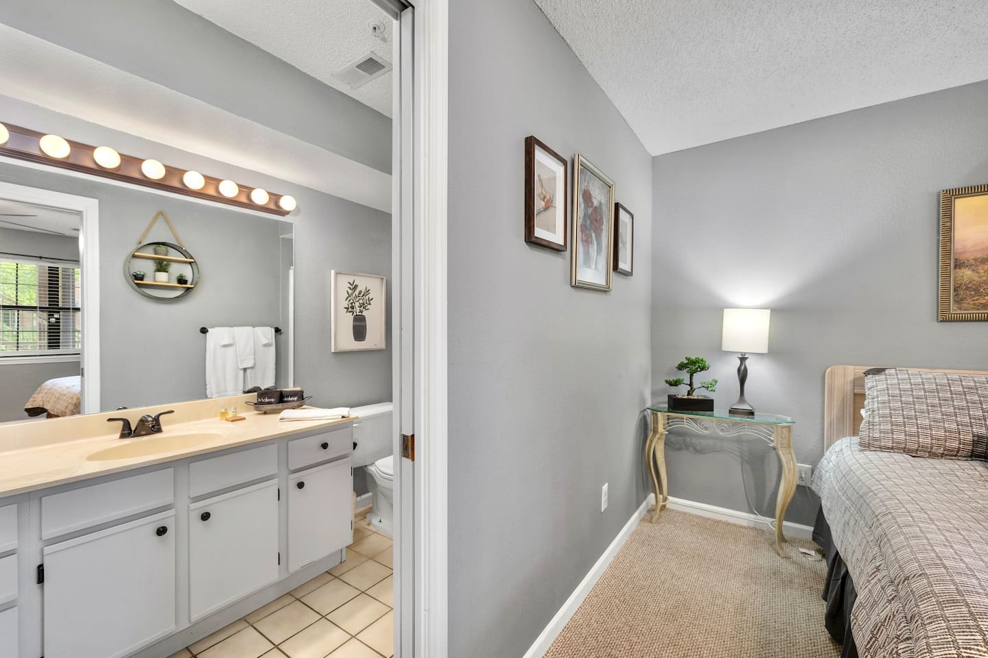 Bath Retreat: Stylish space with sleek fixtures and bright lighting, perfect for a refreshing start!