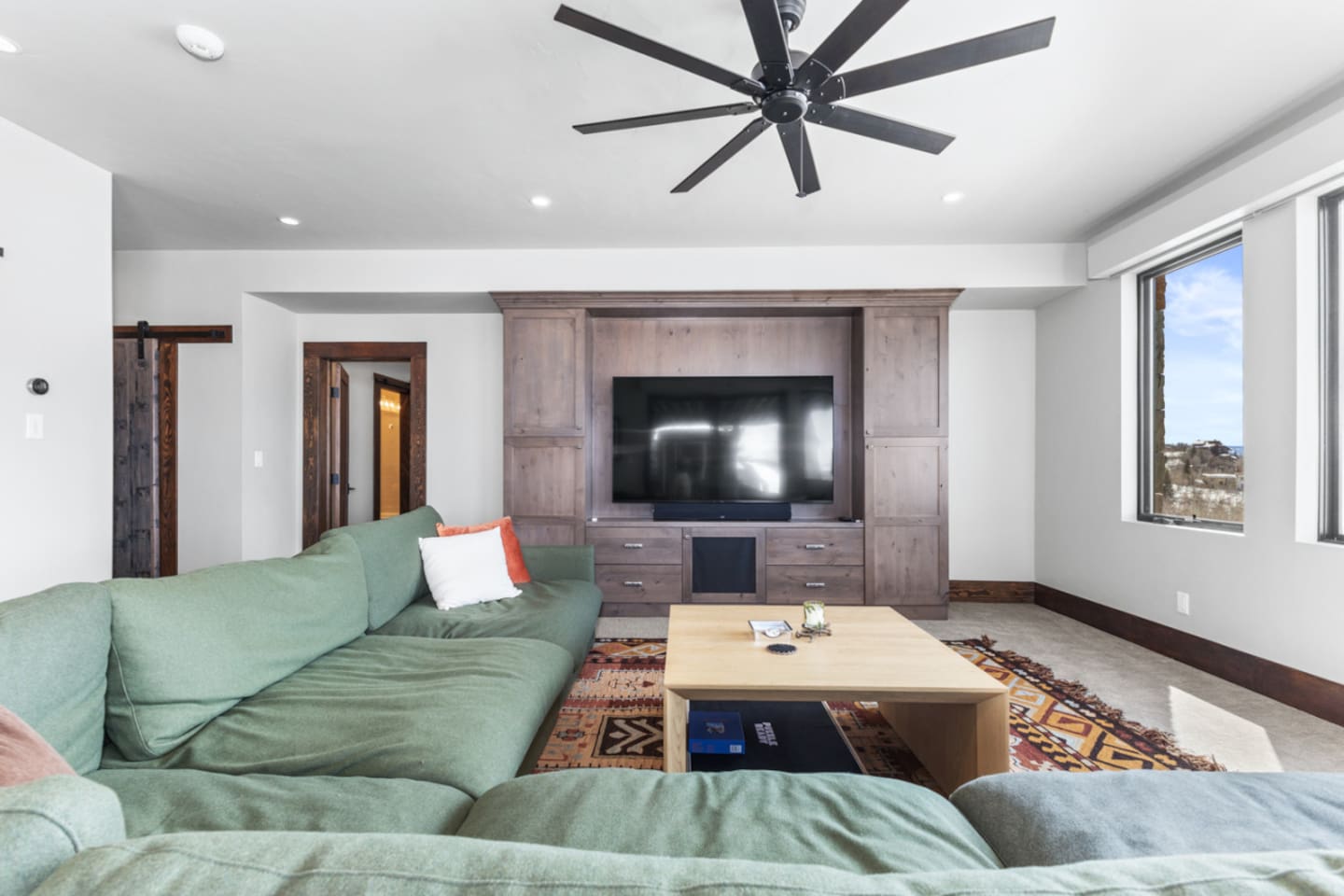 Lower Level Living Room | Ceiling Fan & Smart TV