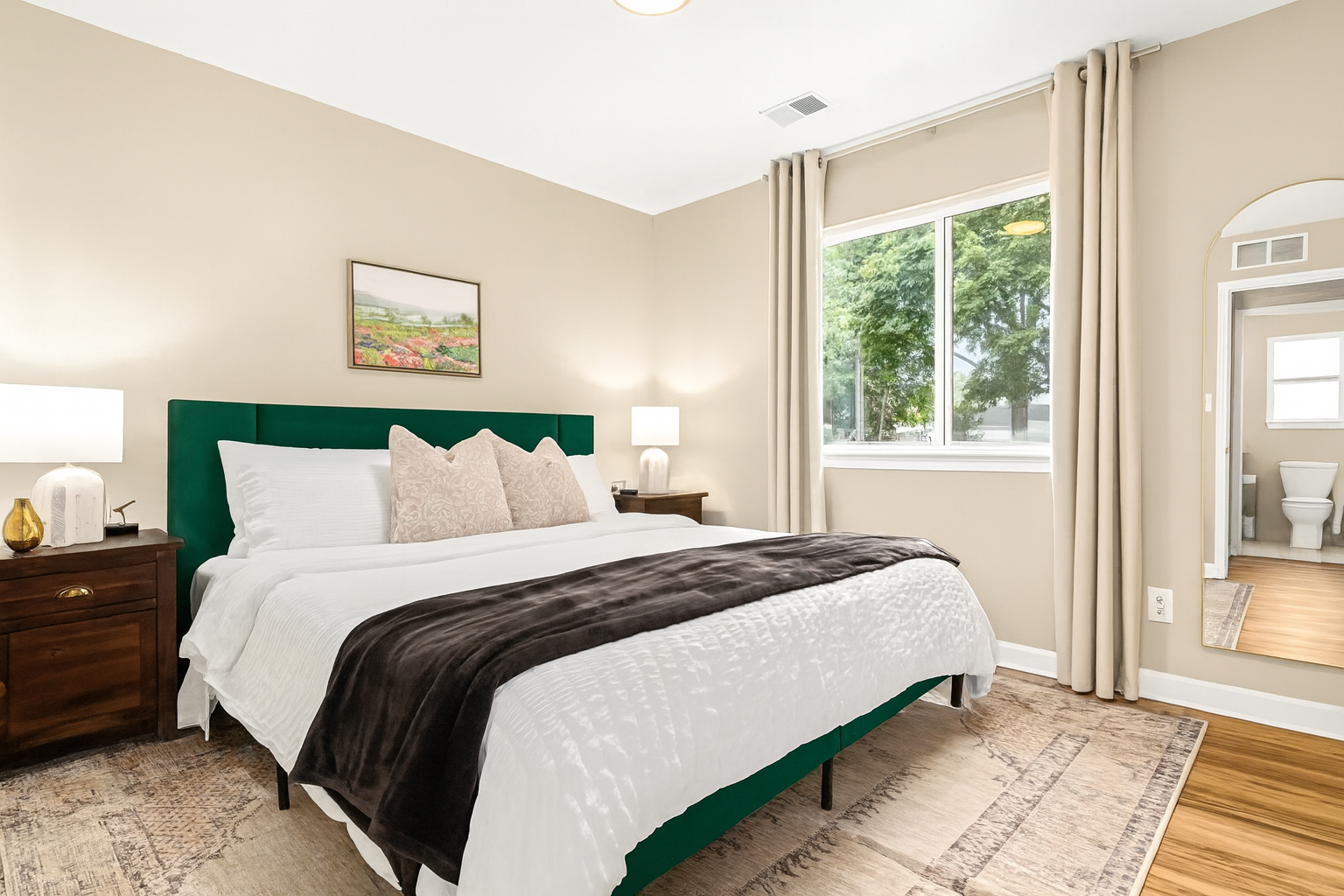 Experience the luxurious comfort of our king-size bed adorned with opulent linens and plush pillows.