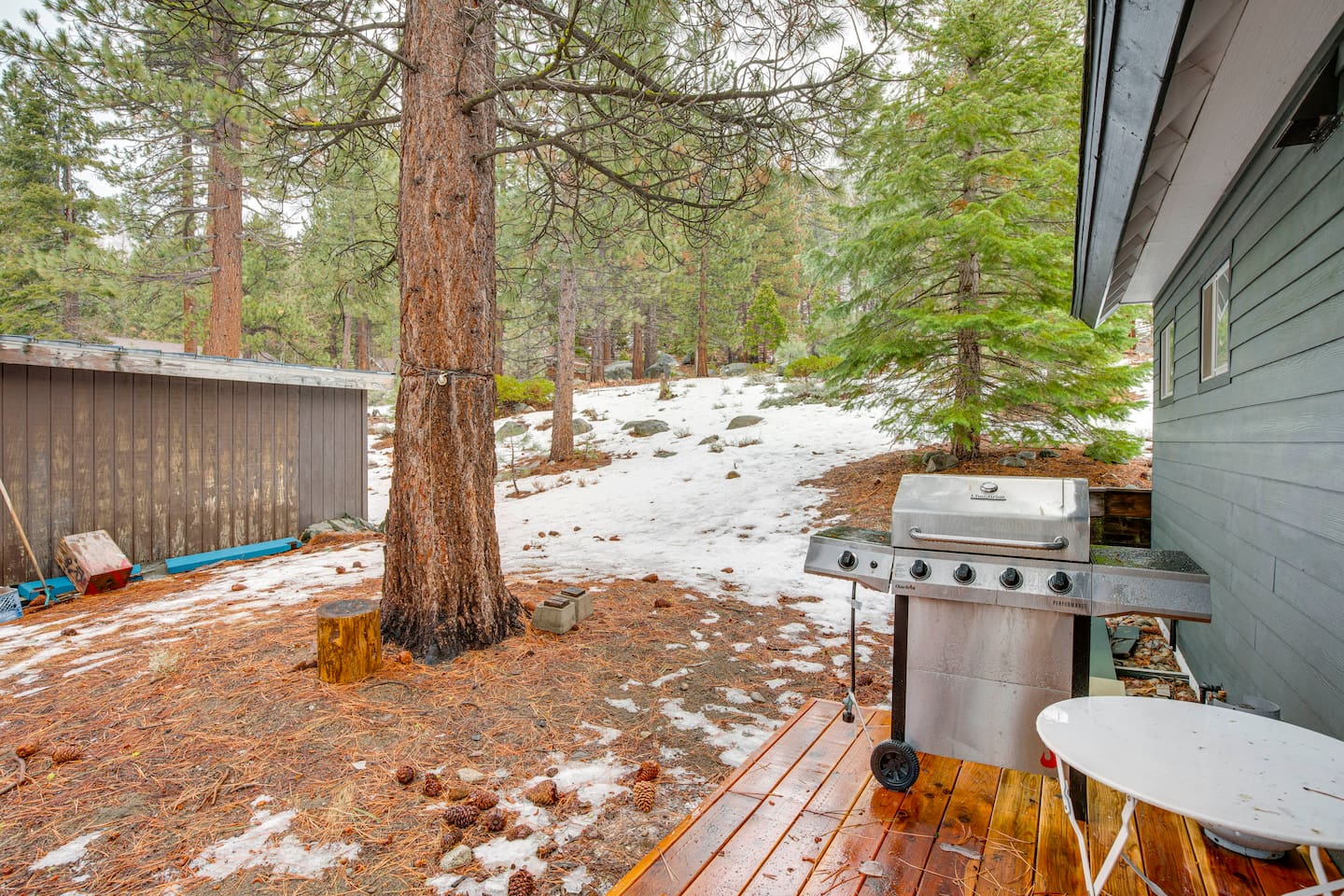 BBQ Grill on the deck with a small outdoor dining table for 2.