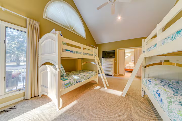 Bunkbedroom separated from primary bedroom by large pocket doors,and from living room by another set of pocket doors