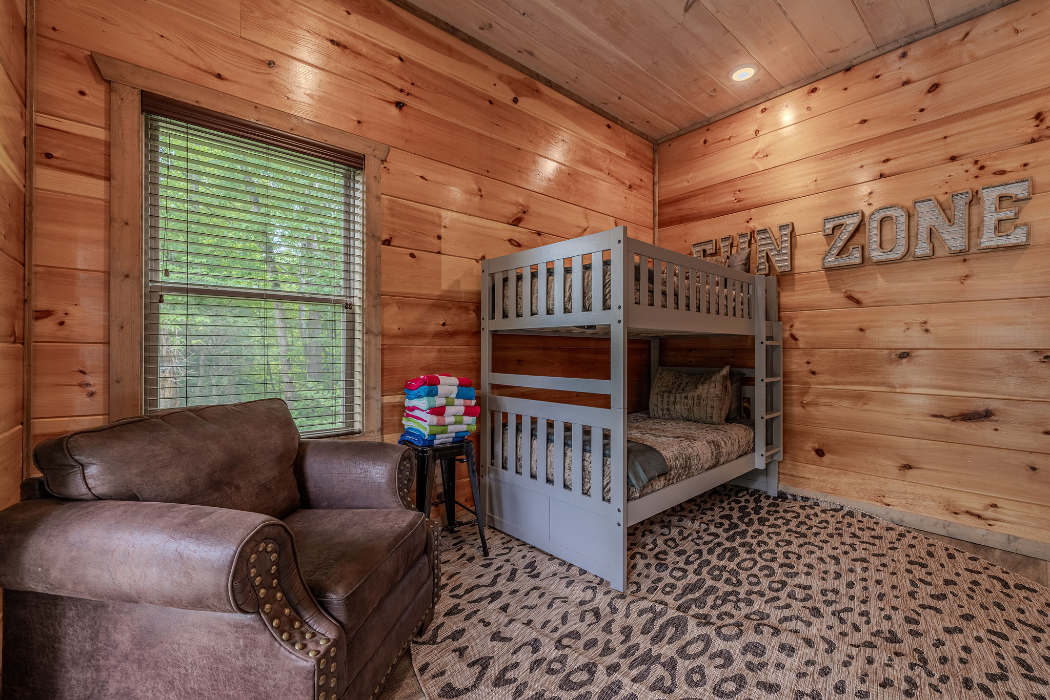 The bunk room offers a fun, adventure-inspired place to rest after pool time, games, and Smoky Mountain exploring.