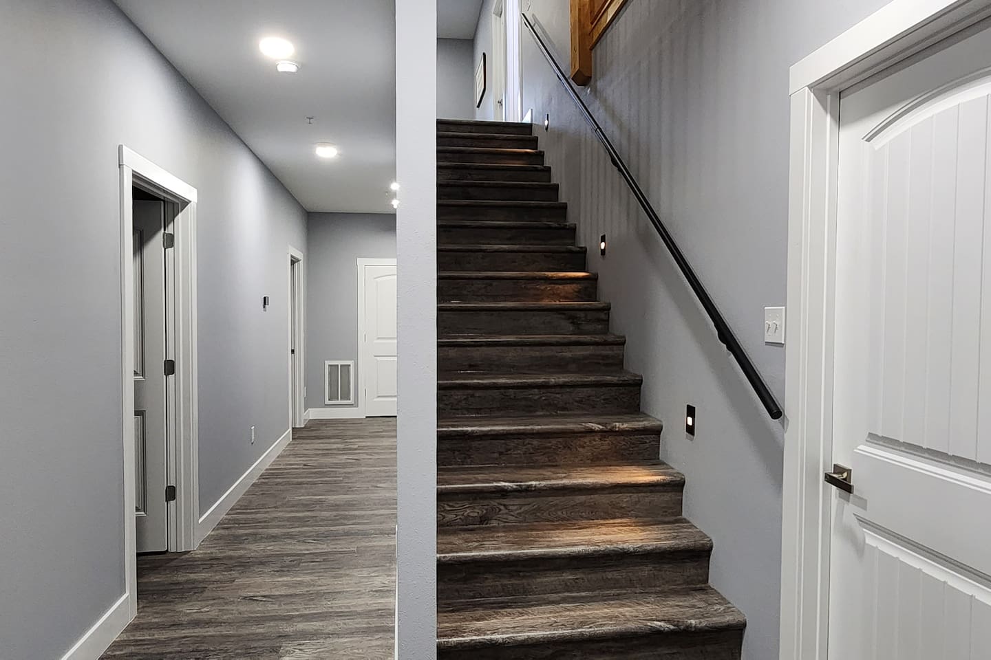 Interior staircase linking shared spaces and sleeping areas.