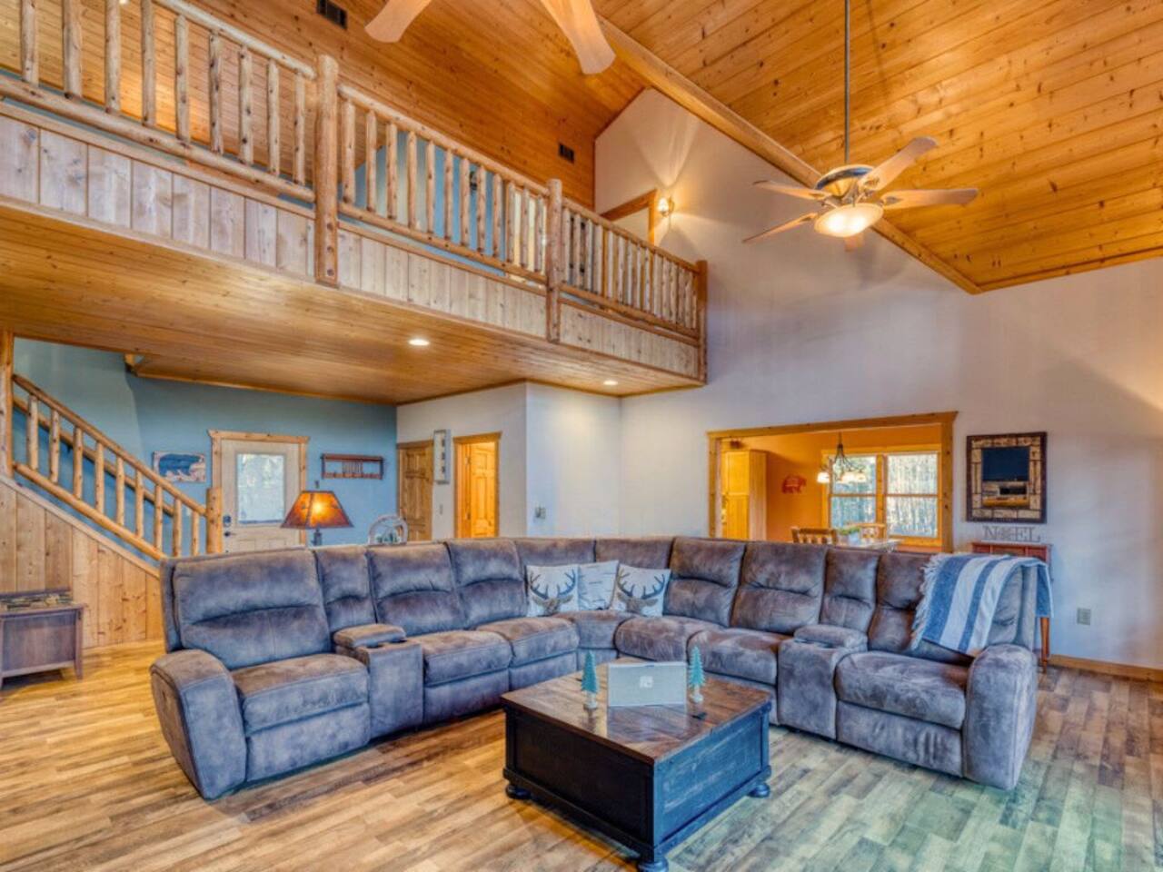 Sink into the plush comfort of the couch in our warmly inviting living room.