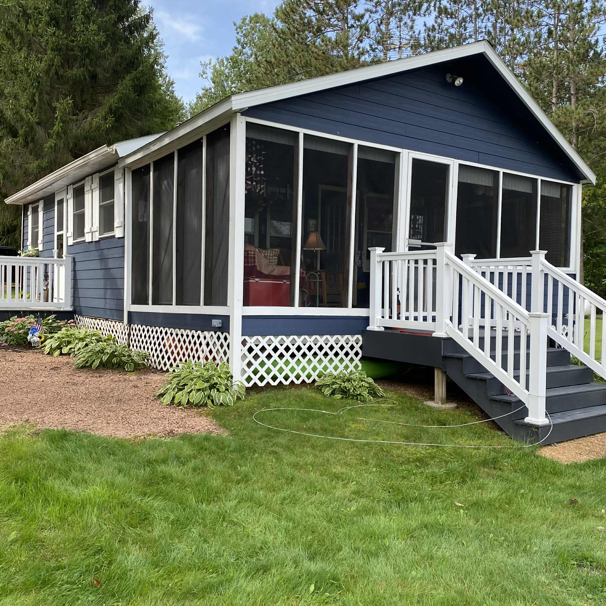 Screened in proch overlooking the water.