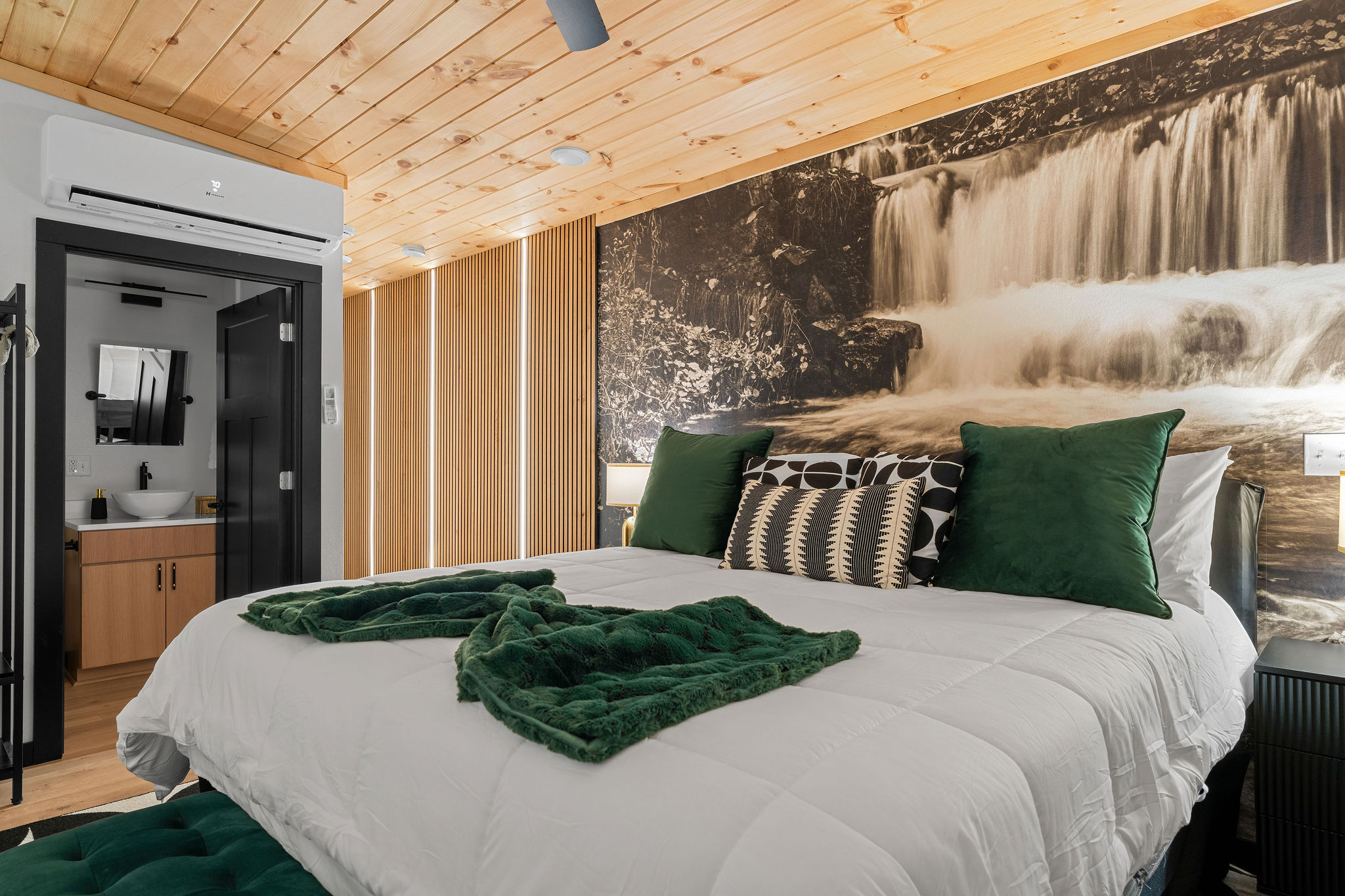 Lofted Bedroom Retreat: Modern lighting accents continue upstairs in the serene king loft suite