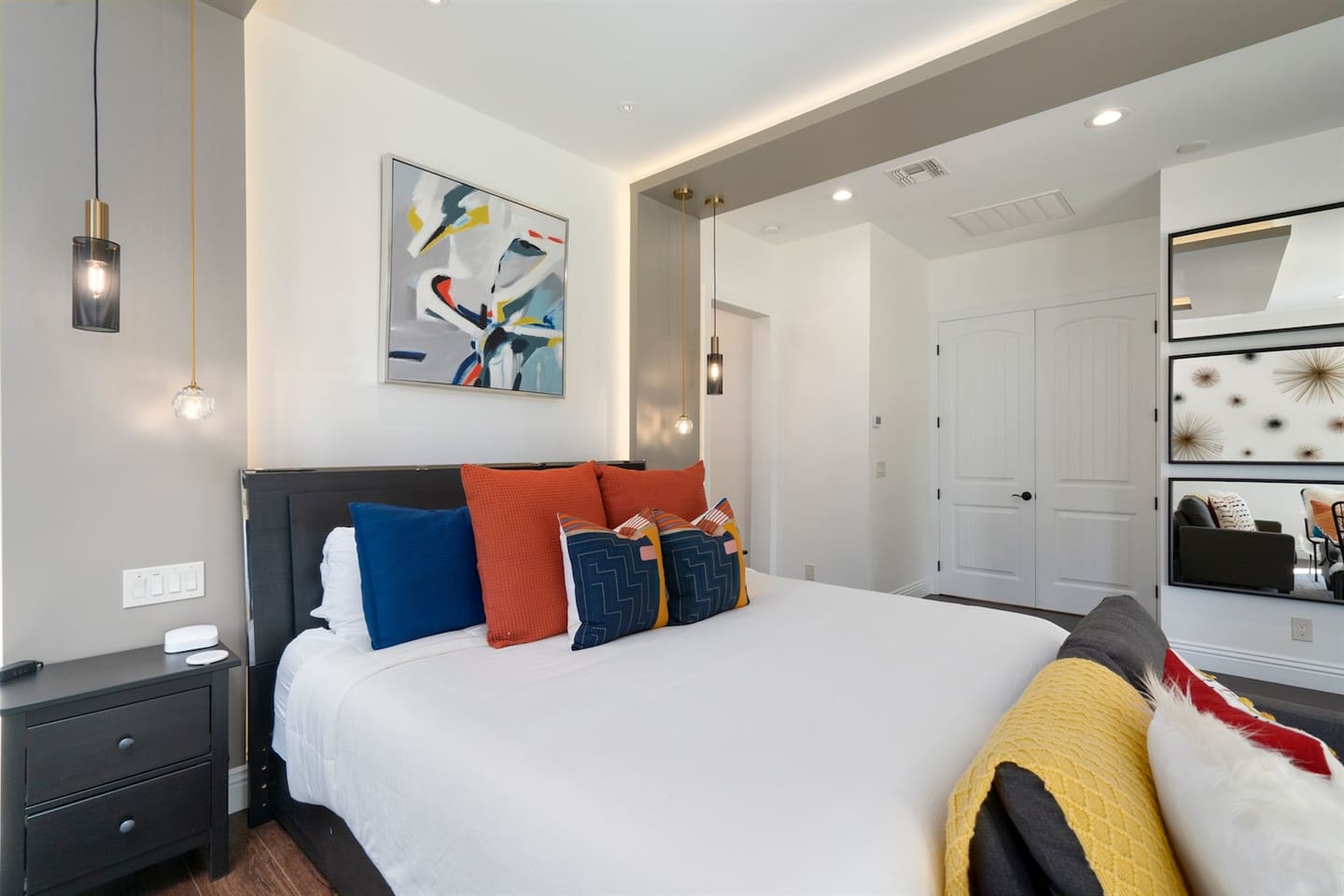 Relax in luxury! This spacious bedroom features a cozy mini living area, vibrant pillows, and a unique design that blends comfort and style. The perfect place to unwind after a day of exploring.