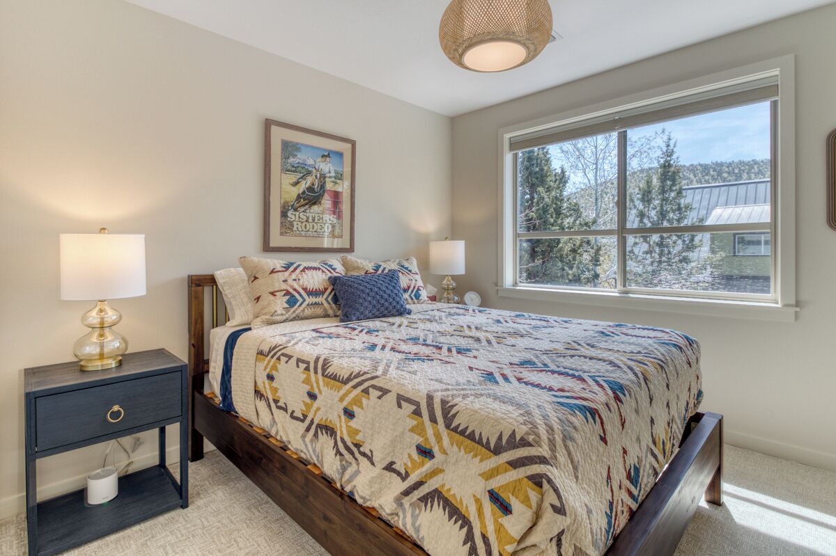 Queen bedroom with cozy linens and peaceful ambiance