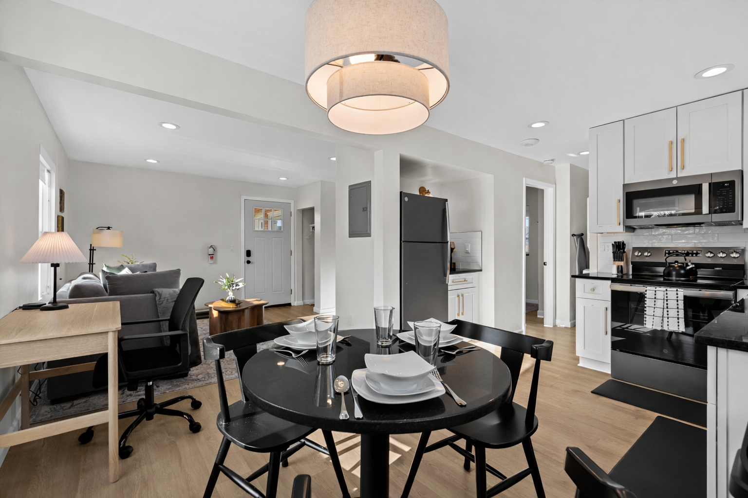Open-concept dining and kitchen area with modern finishes, stylish lighting, and seamless flow into the living space—perfect for dining, working, and relaxing.