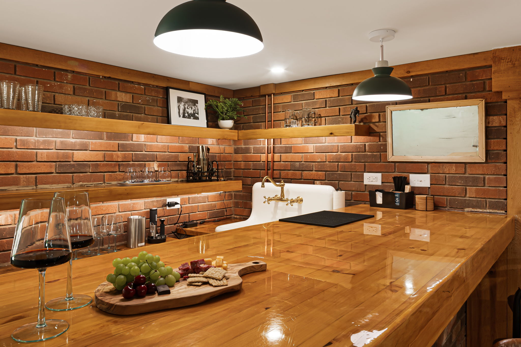 The bar areas was also redone and restored for modern days. It has all the essentials for entertaining, including a small fridge, blender, different types of glassware and a vintage cast iron sink for quick dish clean up. 