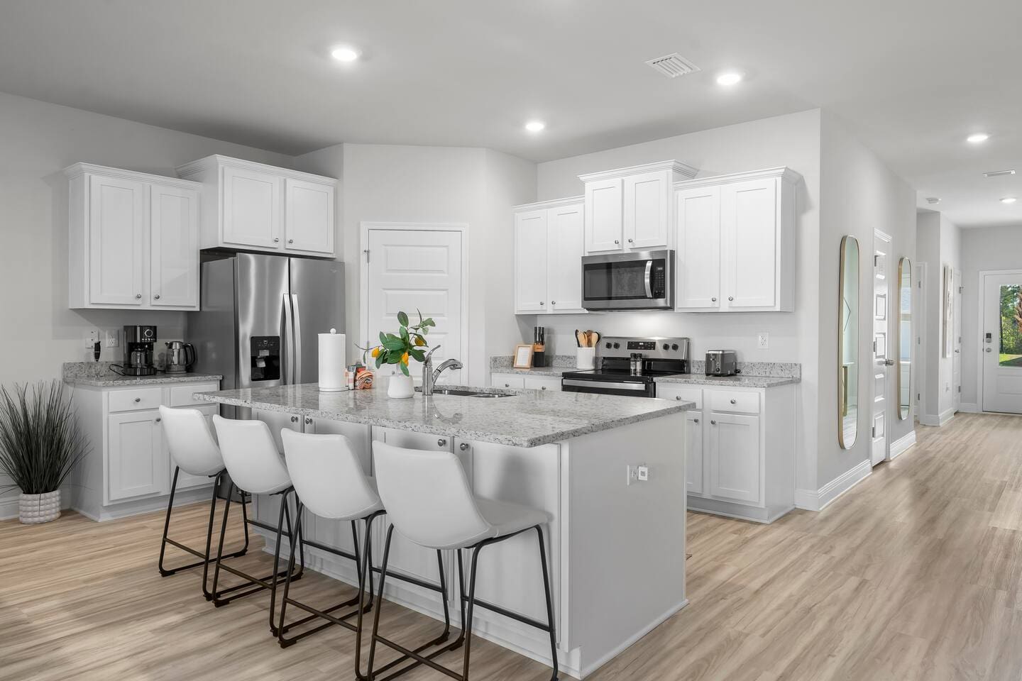 Perfect for cooking and socializing—a full kitchen with counter seating and all essential appliances.