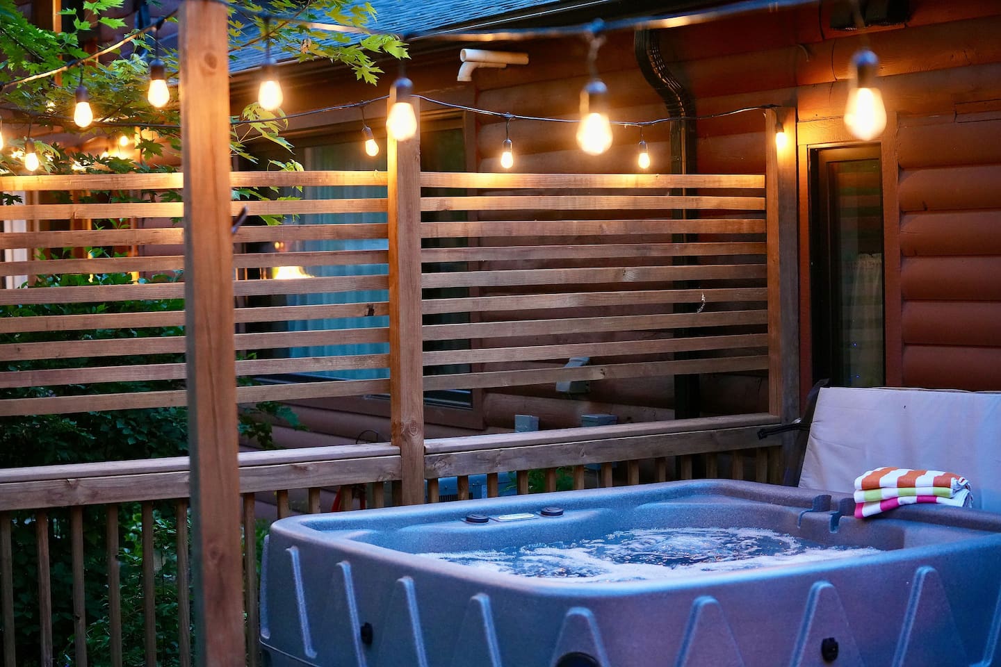 Relax in the hot tub under the cozy cafe lights. 