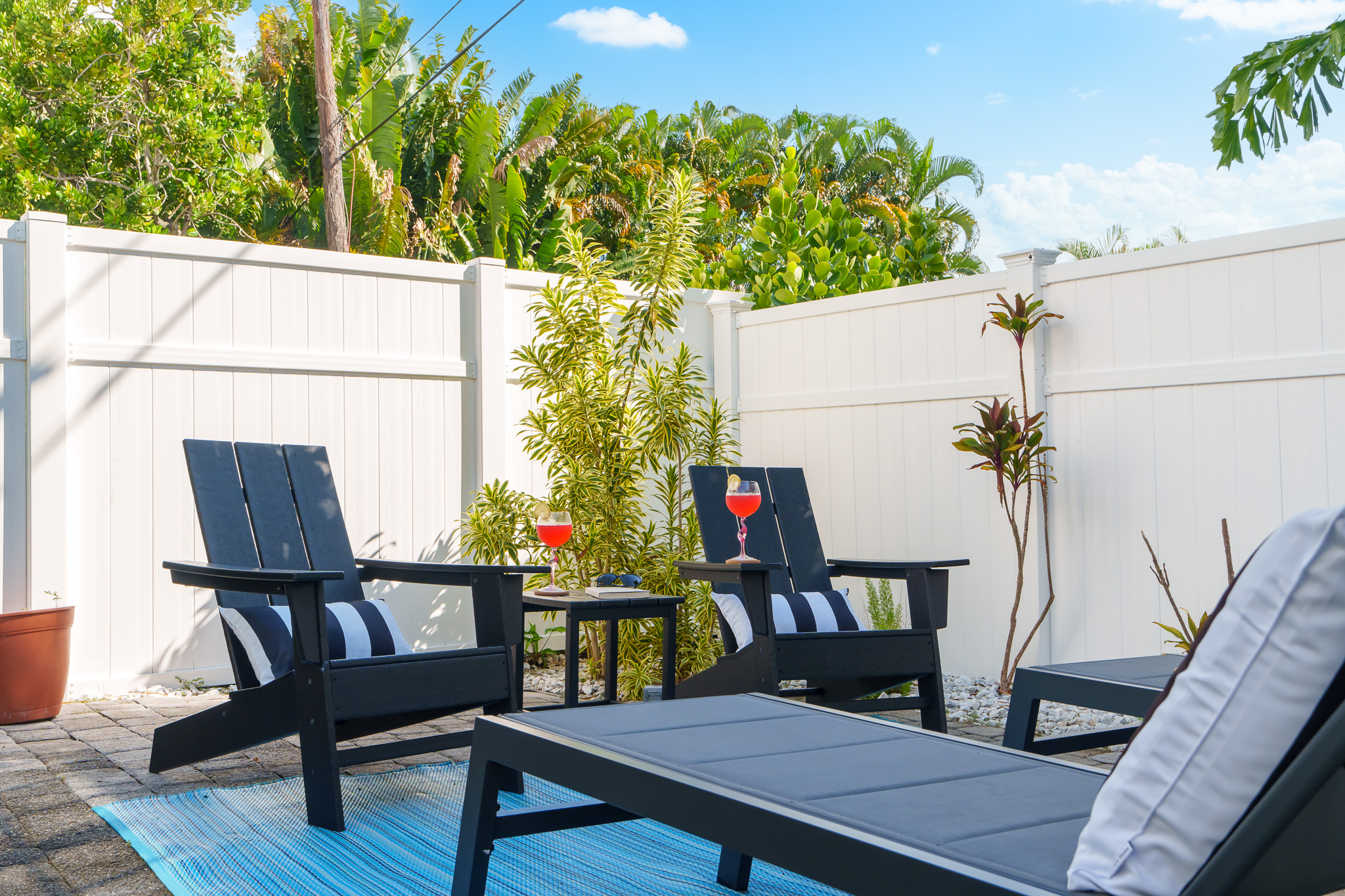 Back patio, 2 lounge chairs, 2 adirondak chairs