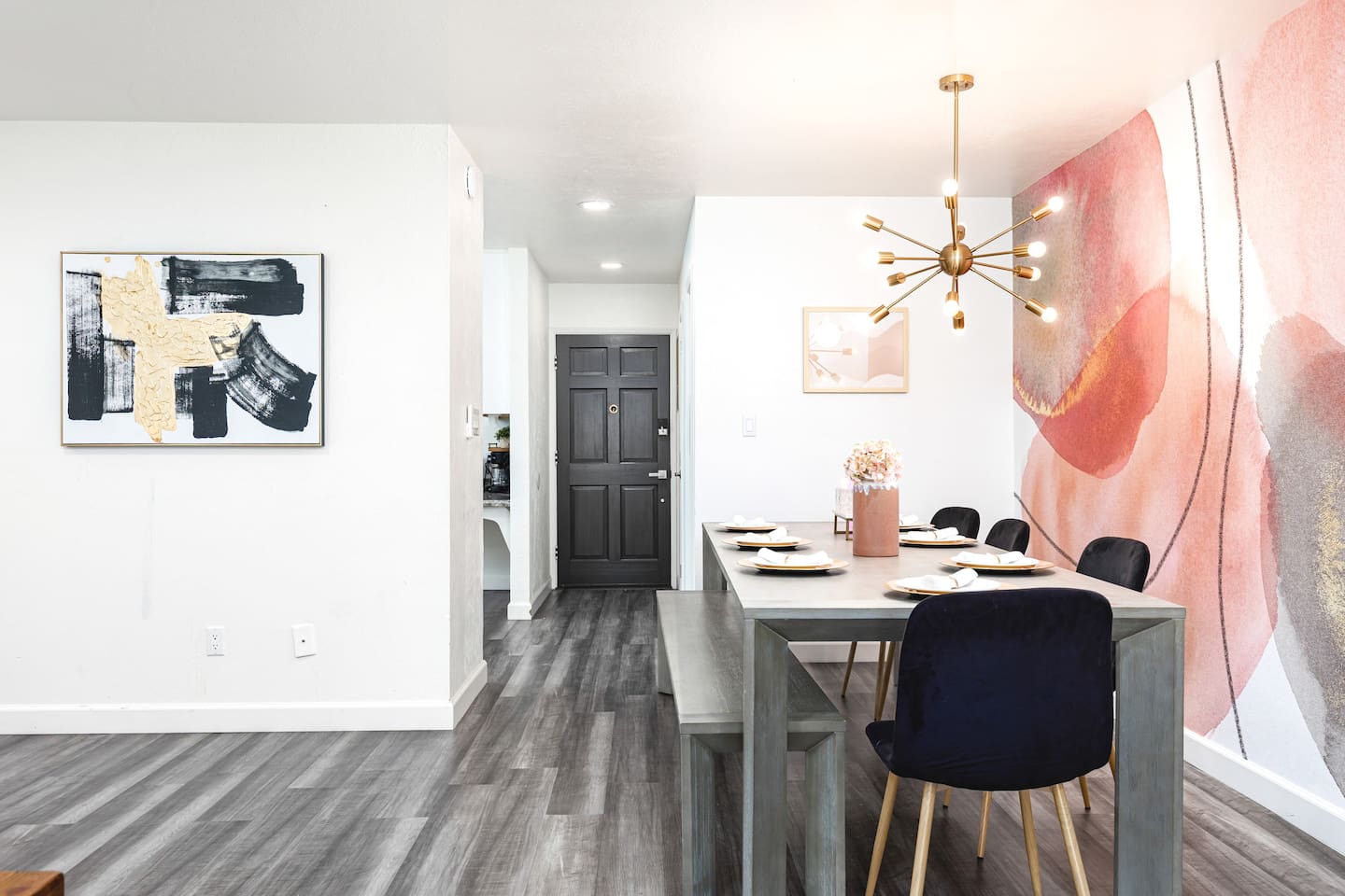 Located just off the entryway, the dining area welcomes guests with stylish decor and inviting tones.

