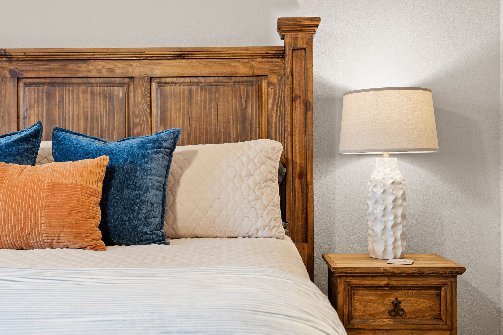 Bedroom detail with nightstand and lamp