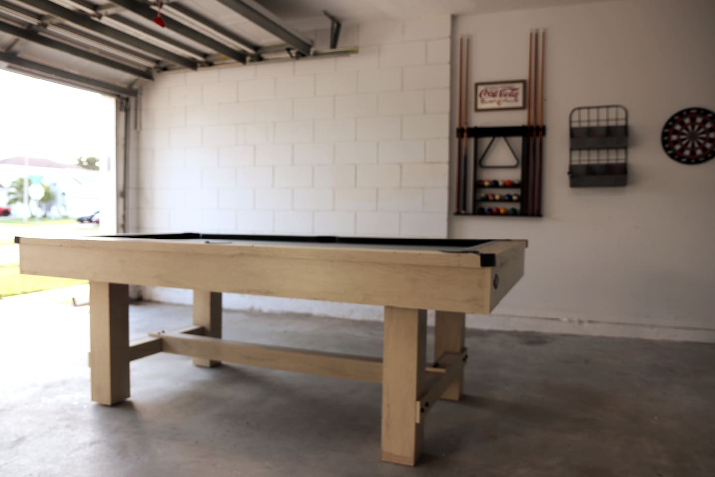 Garage game-room with pool table and kid-friendly magnet dart board (no air-conditioning in the garage).  