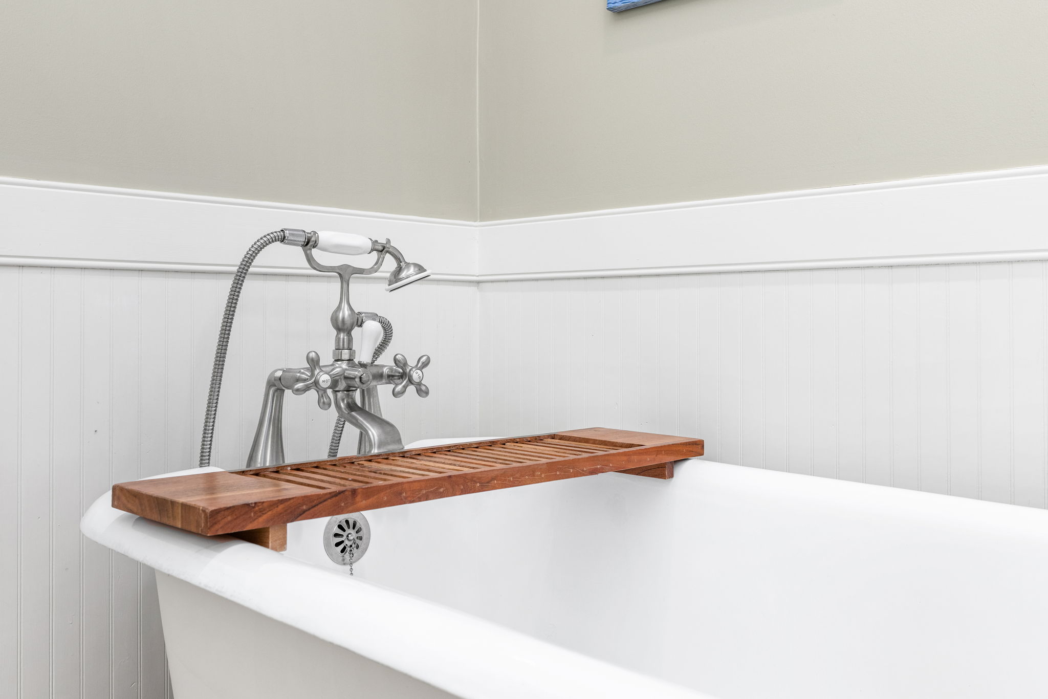 Bathroom Retreat: Unwind in a stylish soaking tub with vintage charm and modern fixtures!