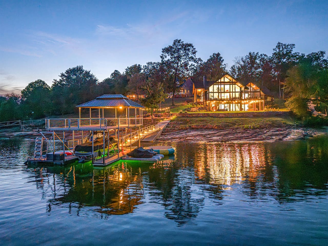 Picture returning after a night boat ride — your family walking up the dock toward the glowing home.